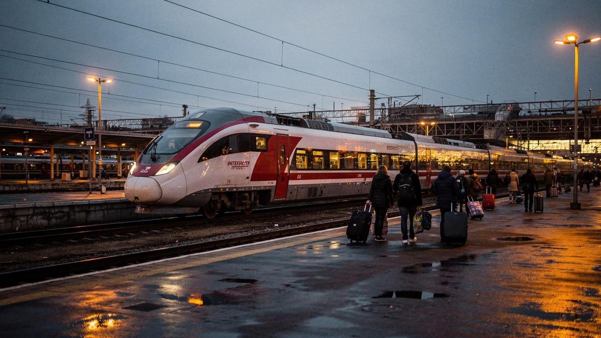 Night train waiting at Kyiv-Pasazhyrskyi platform before a Friday weekend departure